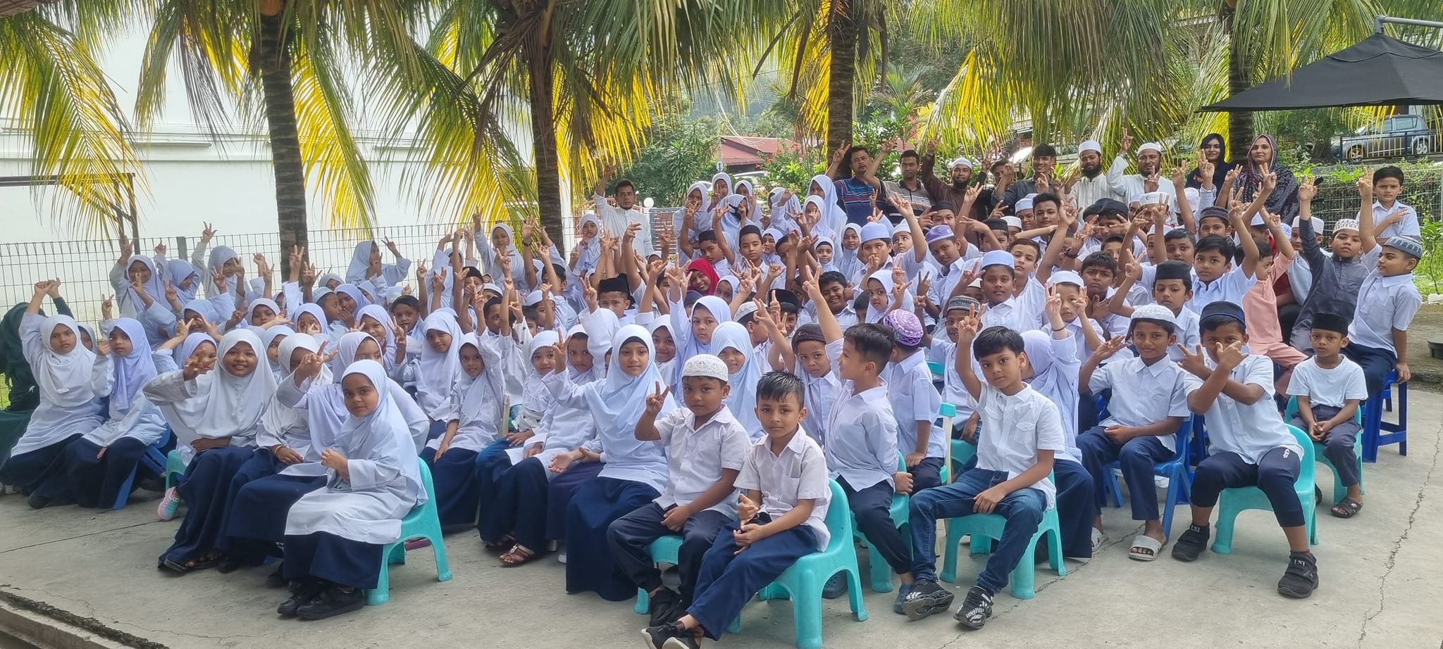 Students listening attentively to a teacher in a classroom